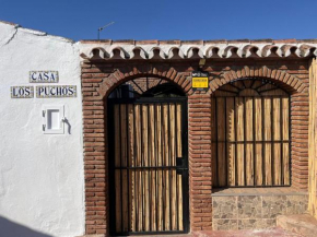 Los Puchos, Alora